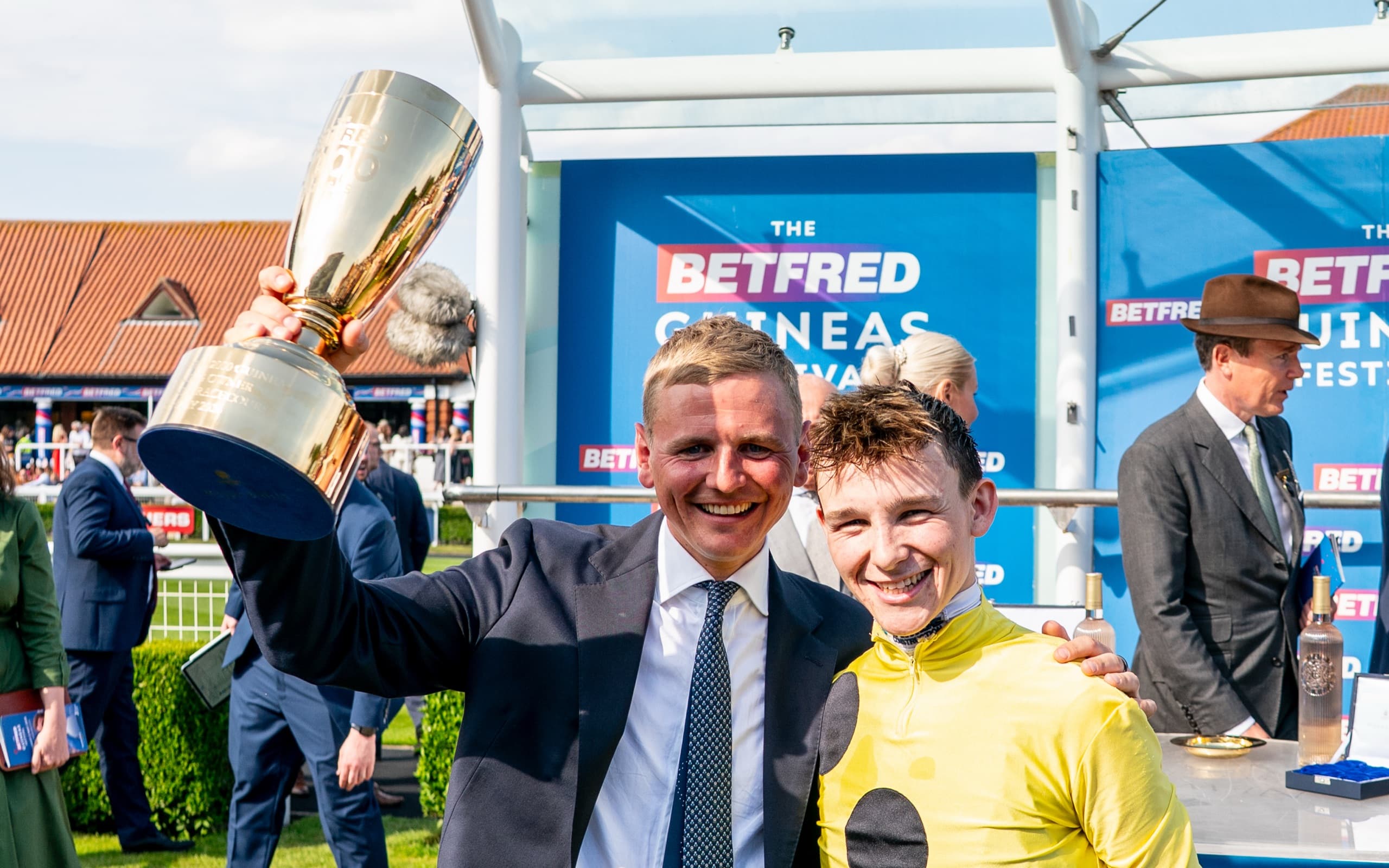 George Boughey lifting a trophy with his winning jockey